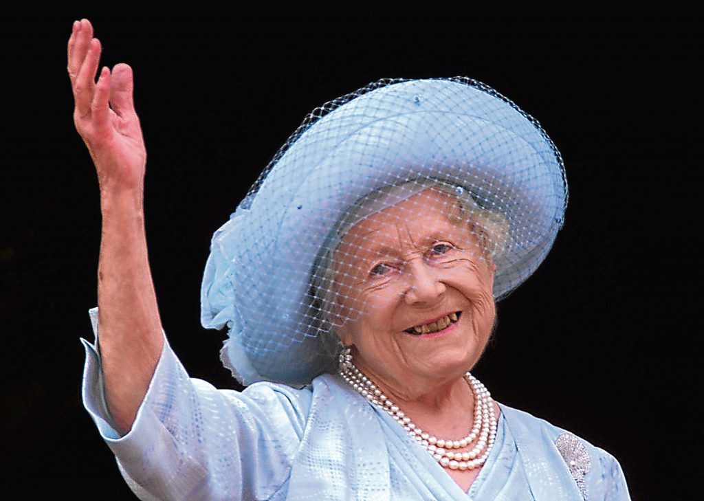 Queen Elizabeth, the Queen Mother celebrates her 100th birthday from the balcony of Buckingham Palace. 