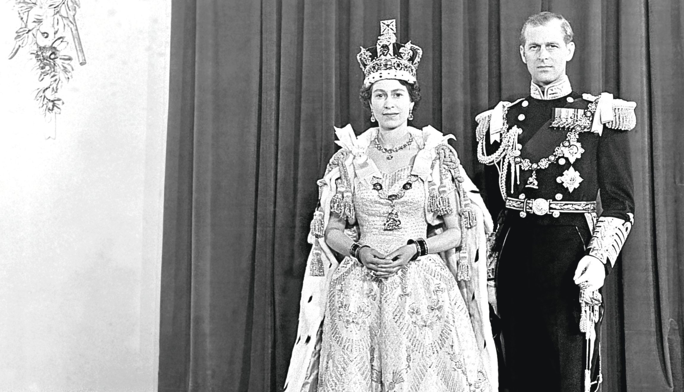 Queen Elizabeth II and her husband the Duke of Edinburgh at Buckingham Palace after her coronation in Westminster Abbey