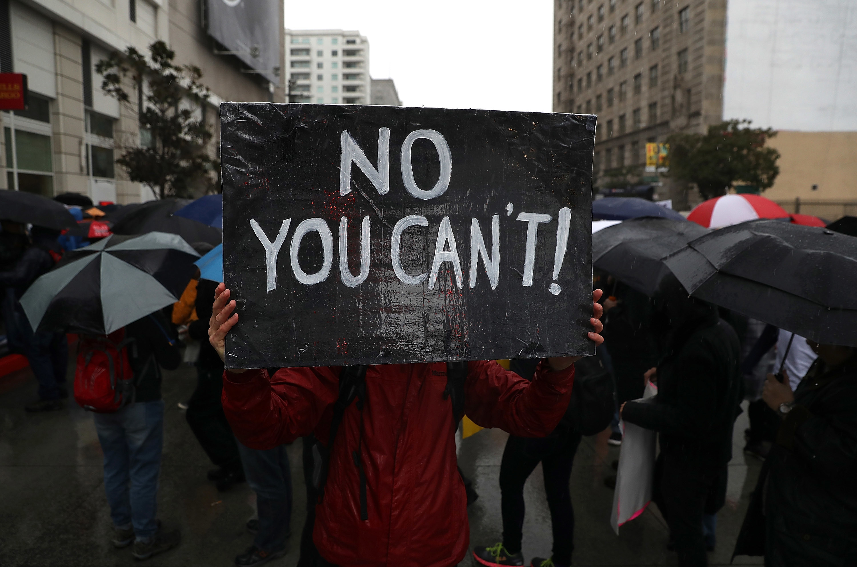 A protester in Los Angeles holds a sign during a demonstration against U.S. President Donald Trump. (Photo by Justin Sullivan/Getty Images)