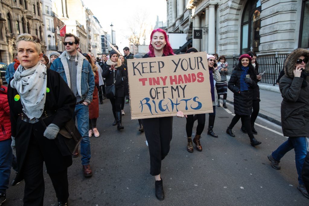 LONDON, ENGLAND - JANUARY 21: A protester carries a placard as they march from The US Embassy in Grosvenor Square towards Trafalgar Square during the Women's March on January 21, 2017 in London, England. The WomenÕs March originated in Washington DC but soon spread to be a global march calling on all concerned citizens to stand up for equality, diversity and inclusion and for womenÕs rights to be recognised around the world as human rights. Global marches are now being held, on the same day, across seven continents. (Photo by Jack Taylor/Getty Images)