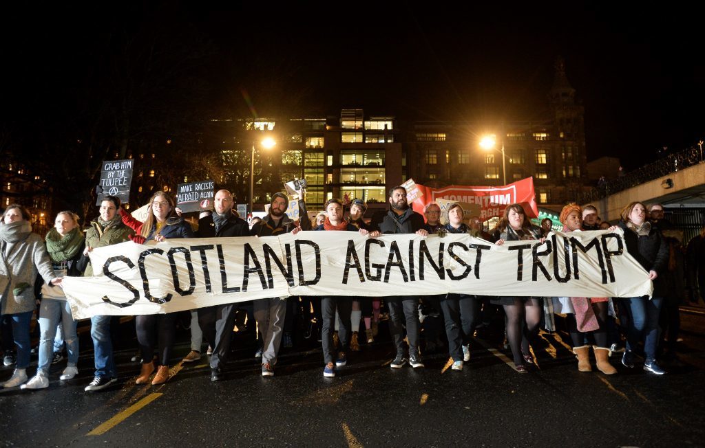 EDINBURGH, SCOTLAND - JANUARY 30: Demonstrators march from the Mound to the Scottish Parliament to protest against President Trump's Muslim travel ban to the USA on January 30, 2017 in Edinburgh, Scotland. President Trump signed an executive order on Friday banning immigration to the USA from seven muslim countries. This led to protests across America and, today, a British petition asking for the downgrading of Trump's State visit passed one million signatures this morning. (Photo by Mark Runnacles/Getty Images)