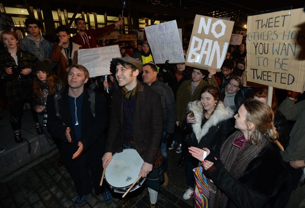 EDINBURGH, SCOTLAND - JANUARY 30: Demonstrators march from the Mound to the Scottish Parliament to protest against President Trump's Muslim travel ban to the USA on January 30, 2017 in Edinburgh, Scotland. President Trump signed an executive order on Friday banning immigration to the USA from seven muslim countries. This led to protests across America and, today, the UK. A British petition asking for the downgrading of Trump's State visit passed one million signatures this morning. (Photo by Mark Runnacles/Getty Images)