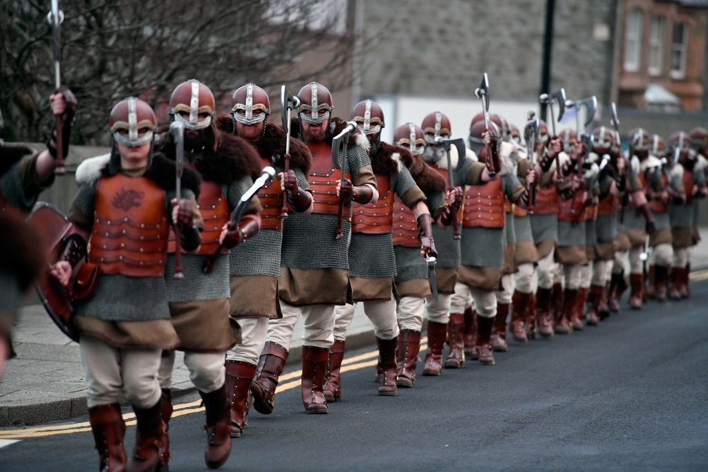 LERWICK, SCOTLAND - JANUARY 31: Members of the Jarl Squad march through the streets of Lerwick on January 31, 2017 in the Shetland Islands, Scotland. The traditional festival of fire is known as 'Up Helly Aa'. The spectacular event takes place annually on the last Tuesday of January. The climax of the day comes with participants in full costume hauling a Viking longboat through the streets of Lerwick to the edge of town where up to 1000 people parade and throw their flaming torches into the galley. (Photo by Jeff J Mitchell/Getty Images)