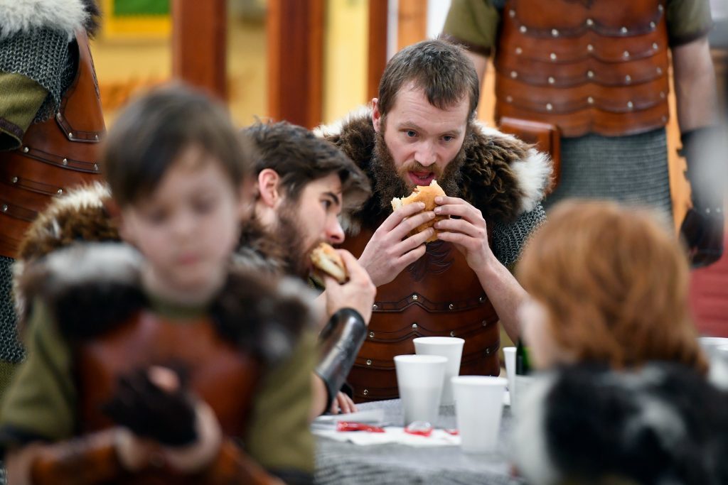 LERWICK, SCOTLAND - JANUARY 31: Participants dressed as Vikings eat breakfast as they prepare to participate in the annual Up Helly Aa festival on January 31, 2017 in Lerwick, Scotland. Up Helly Aa celebrates the influence of the Scandinavian Vikings in the Shetland Islands and culminates with up to 1,000 'guizers' (men in costume) throwing flaming torches into their Viking longboat and setting it alight later in the evening. (Photo by Jeff J Mitchell/Getty Images)