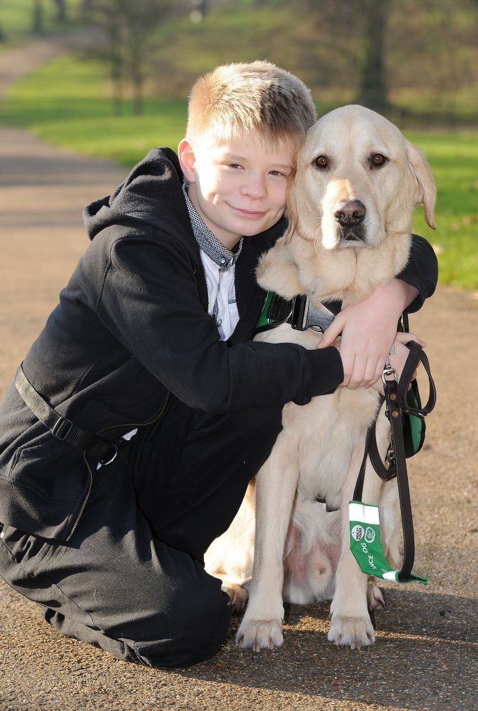 Joel Sawyer, 13, from Newquay, Cornwall, with Caddie, his Labrador (Nick Ansell/PA Wire)
