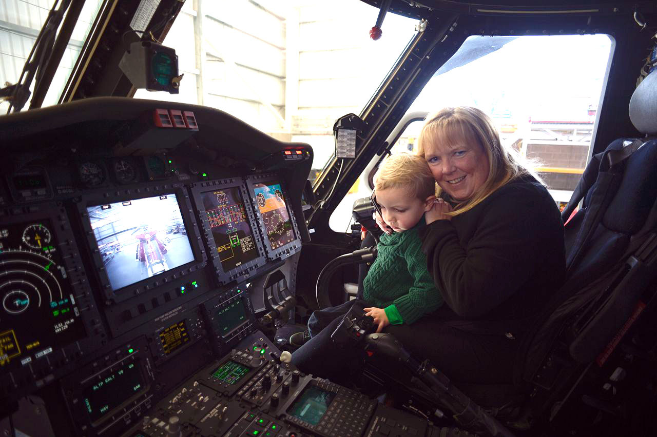 Brenin and Wendy Harper in a helicopter