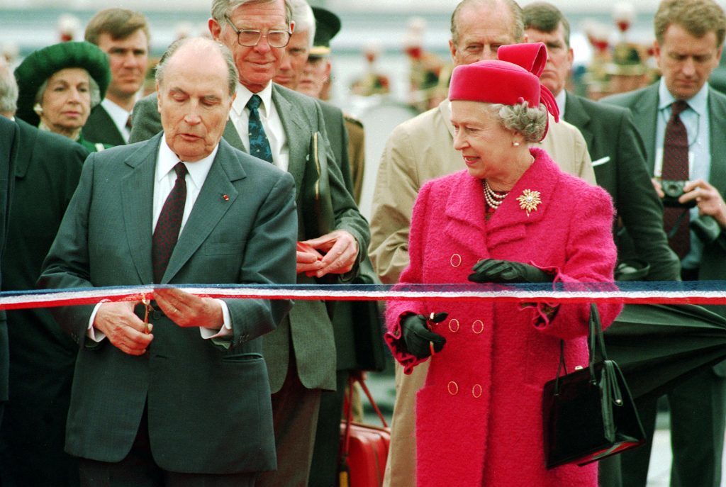 French President Francois Mitterand and the Queen prepare to cut the ribbon at the new terminal for the Channel Tunnel at Coquelles, France.