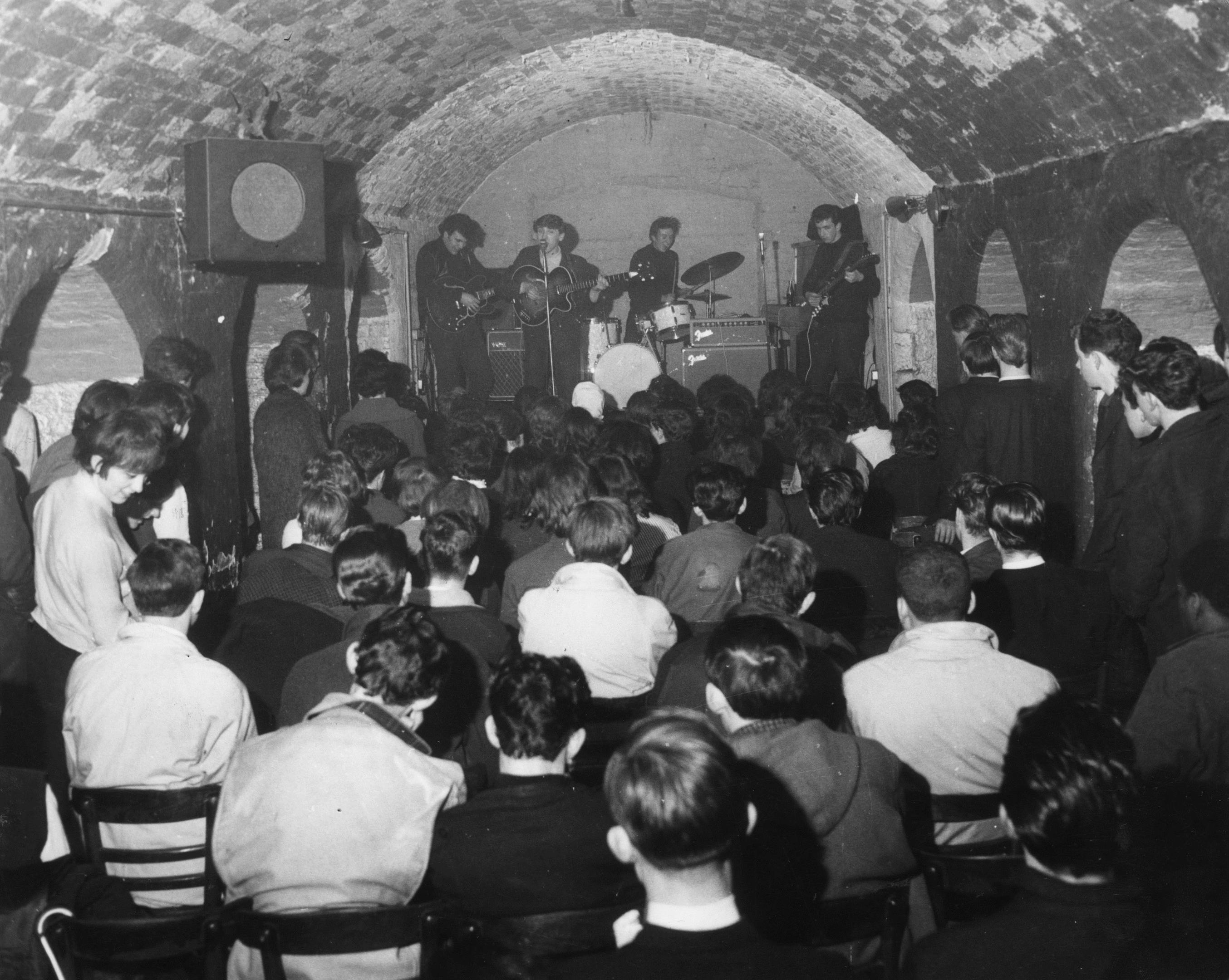 The Merseybeats - named after the musical movement headed by The Beatles - play to a packed Cavern Club audience (Getty Images)