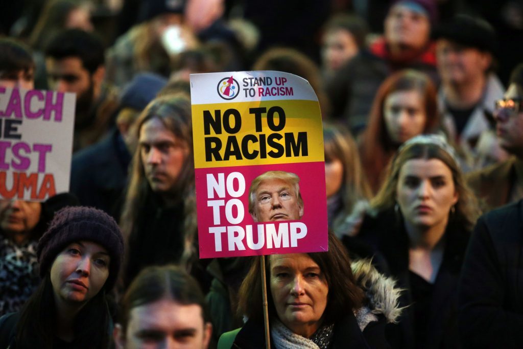 Demonstrators during a protest in Glasgow against US President Donald Trump's controversial travel ban on refugees and people from seven mainly-Muslim countries. PRESS ASSOCIATION Photo. Picture date: Monday January 30, 2017. Photo credit should read: Andrew Milligan/PA Wire