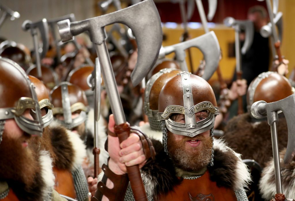 Members of the Jarl Squad dressed in Viking suits stop off at the Royal British Legion club during their parade through the streets in Lerwick on the Shetland Isles during the Up Helly Aa Viking festival. PRESS ASSOCIATION Photo. Picture date: Tuesday January 31, 2017. See PA story SCOTLAND Vikings. Photo credit should read: Jane Barlow/PA Wire