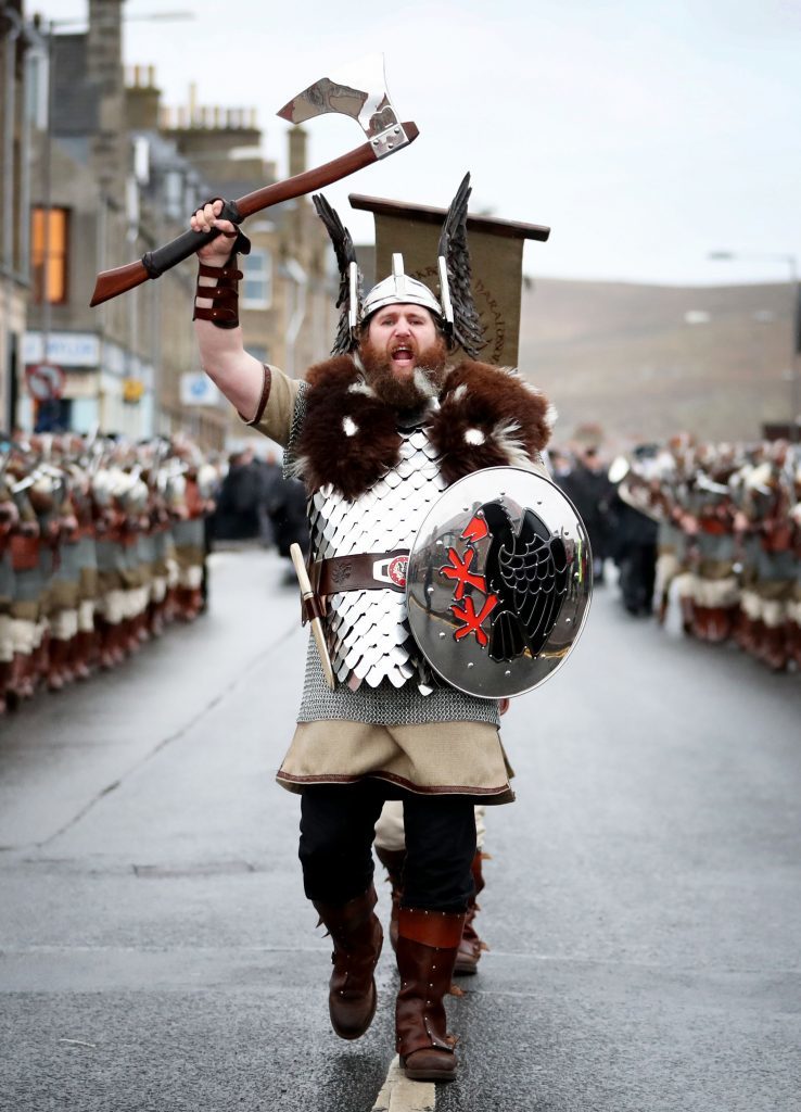 Lyle Hair, the Quizer Jarl, leads the Jarl Squad dressed in Viking suits on a parade through the street in Lerwick on the Shetland Isles during the Up Helly Aa Viking festival. PRESS ASSOCIATION Photo. Picture date: Tuesday January 31, 2017. See PA story SCOTLAND Vikings. Photo credit should read: Jane Barlow/PA Wire