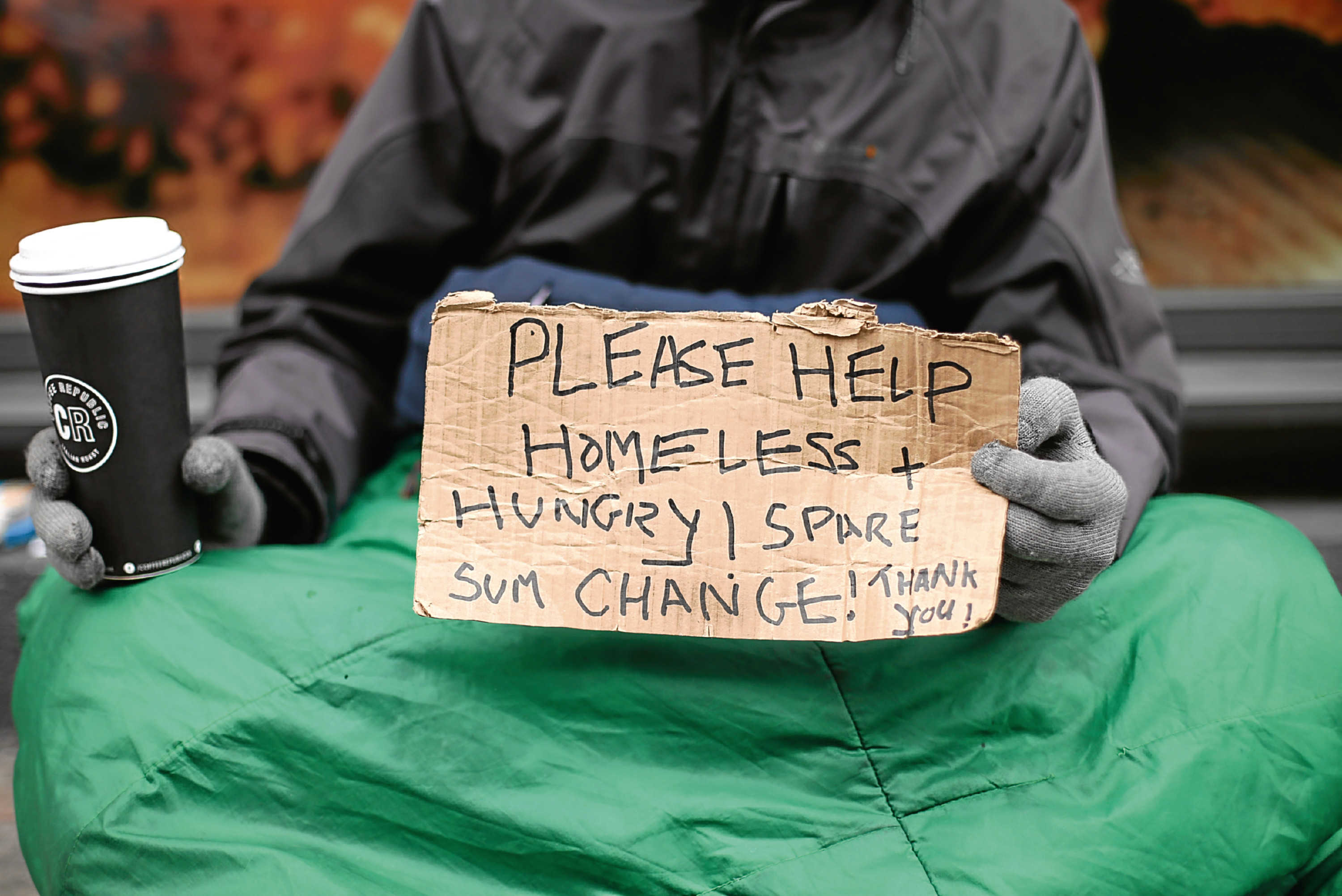 File photo dated 18/03/16 of Lucas, a homeless man, holding a sign reading 'Please help, homeless and hungry' in Victoria, London, as ministers were accused of ignoring the plight of the homeless as new figures showed a sharp rise in the number of people sleeping rough on the streets of England.