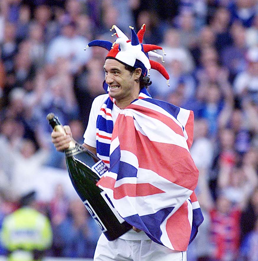 2000: Rangers captain Lorenzo Amoruso cracks open the champagne after helping his side clinch the SPL (SNS Group)