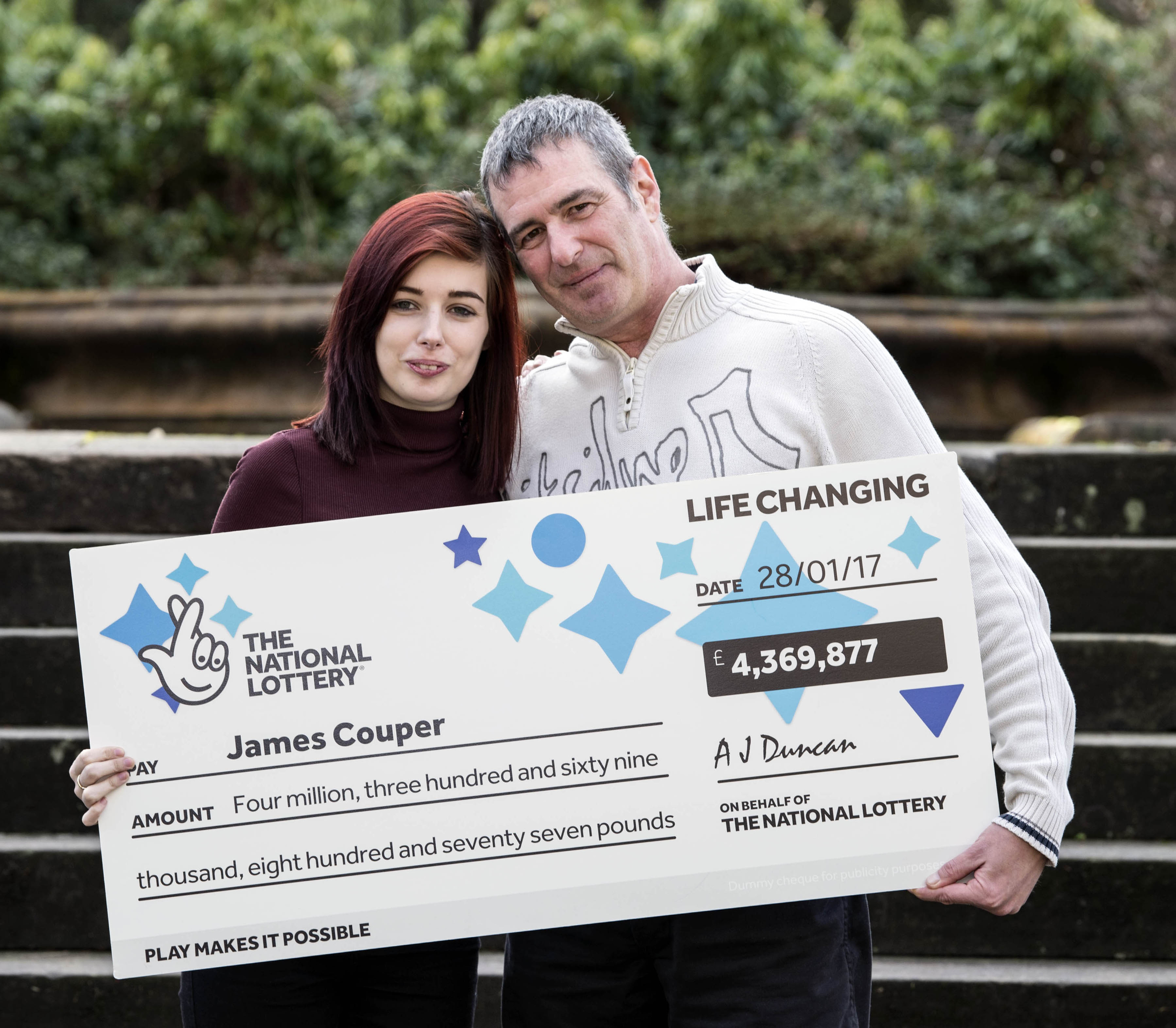 Lotto winner James Couper from Greenock with his daughter Rachel  after he won £4,369,877 in last Saturday's National Lottery draw (Christian Cooksey/Camelot/PA Wire)