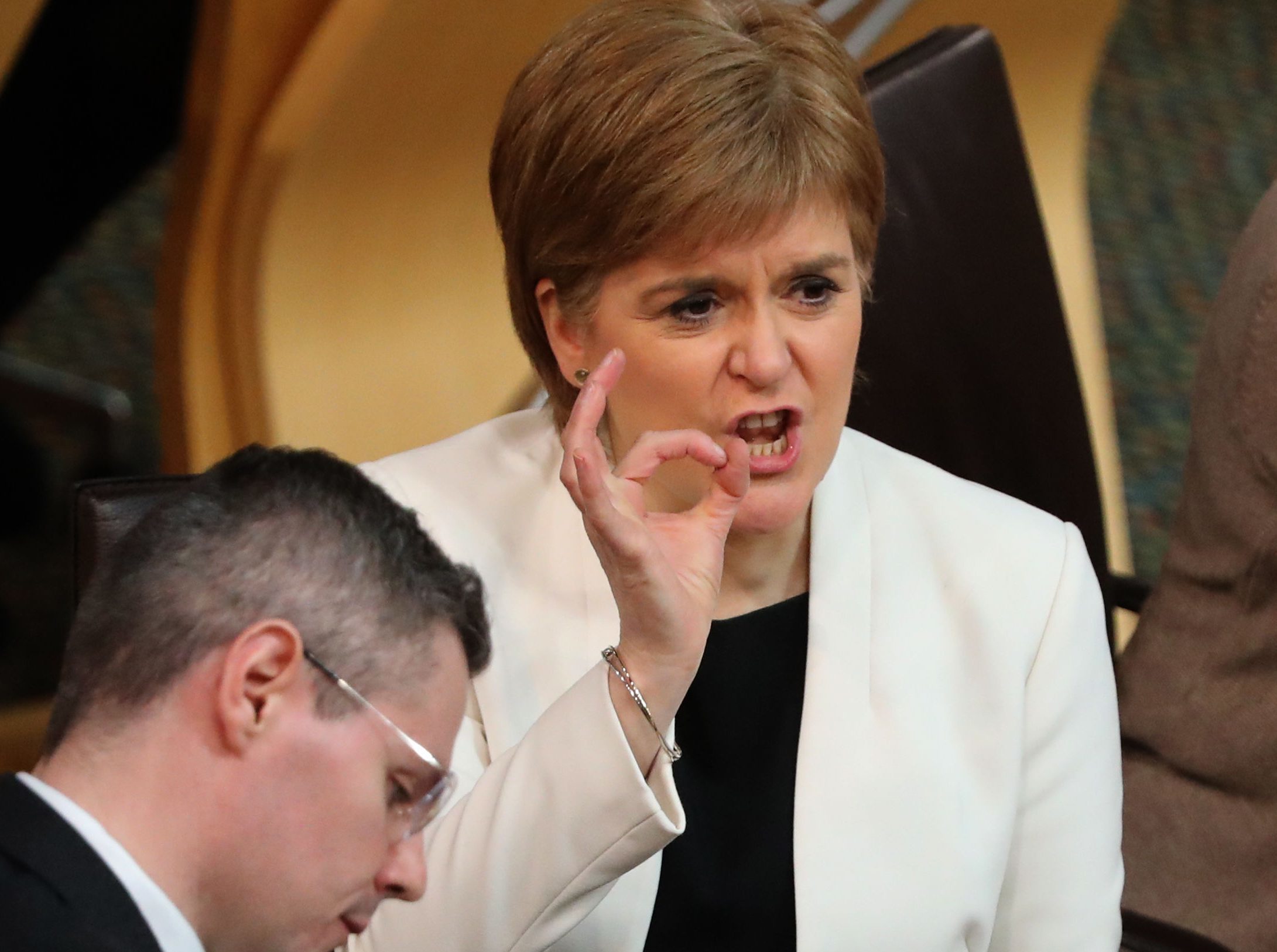 First Minister Nicola Sturgeon after Finance Secretary Derek Mackay's (left) speech during a Budget debate at the Scottish Parliament  (Andrew Milligan/PA Wire)