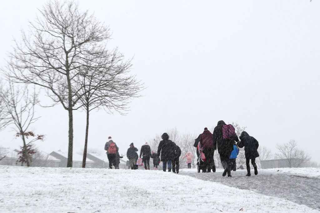 People make their way through the snow in Mauricewood Park in Penicuik, Midlothian, as flights have been cancelled and commuters were warned they faced delays after Storm Doris reached nearly 90mph on its way to batter Britain. PRESS ASSOCIATION Photo. Picture date: Thursday February 23, 2017. See PA story WEATHER Storm. Photo credit should read: Jane Barlow/PA Wire