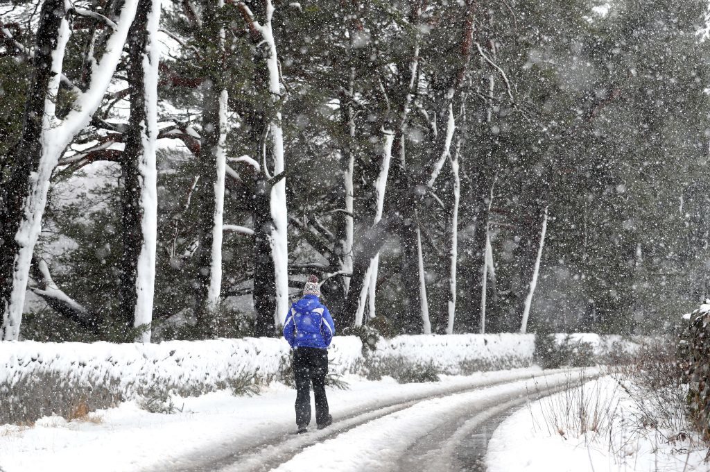 A walker in the snow-covered Pentland Hills, Midlothian after Storm Doris reached nearly 90mph on its way to batter Britain. PRESS ASSOCIATION Photo. Picture date: Thursday February 23, 2017. See PA story WEATHER Storm. Photo credit should read: Jane Barlow/PA Wire