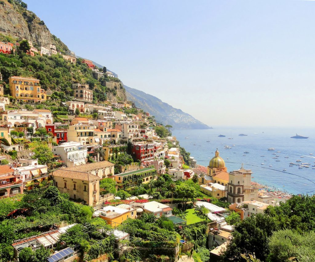 A view from the hill at colorful Positano town with the church and sea (iStock)