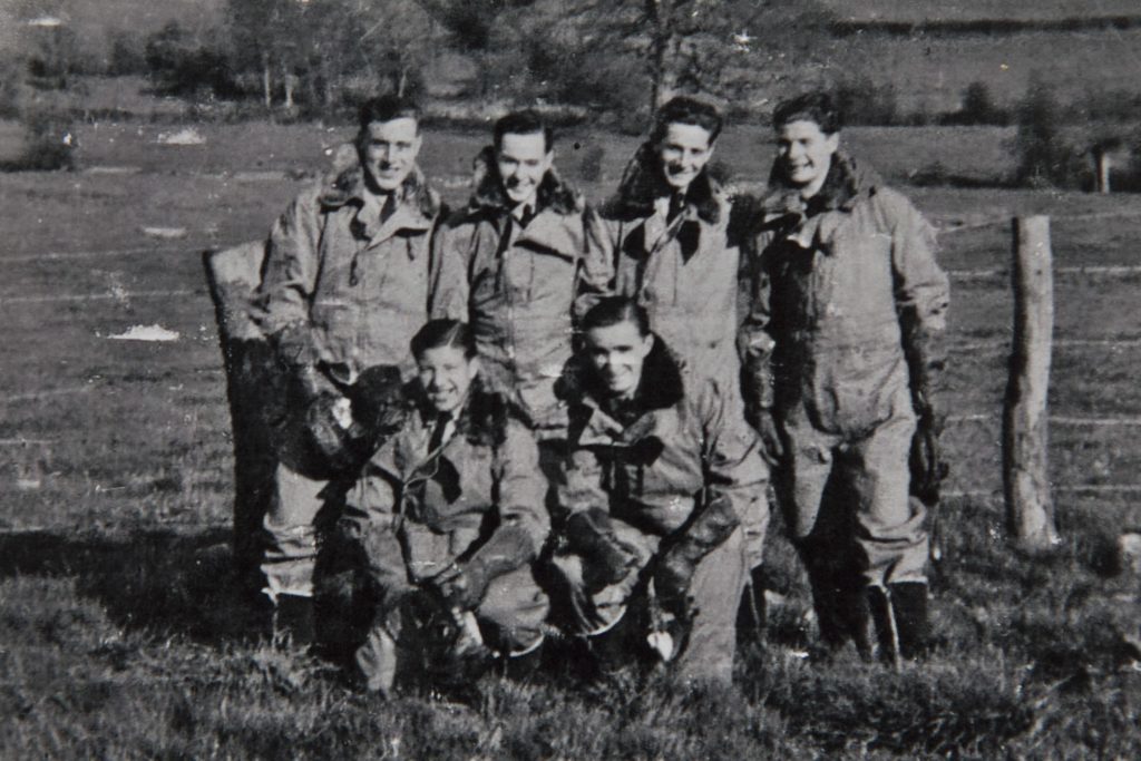 John (front left) and his crew