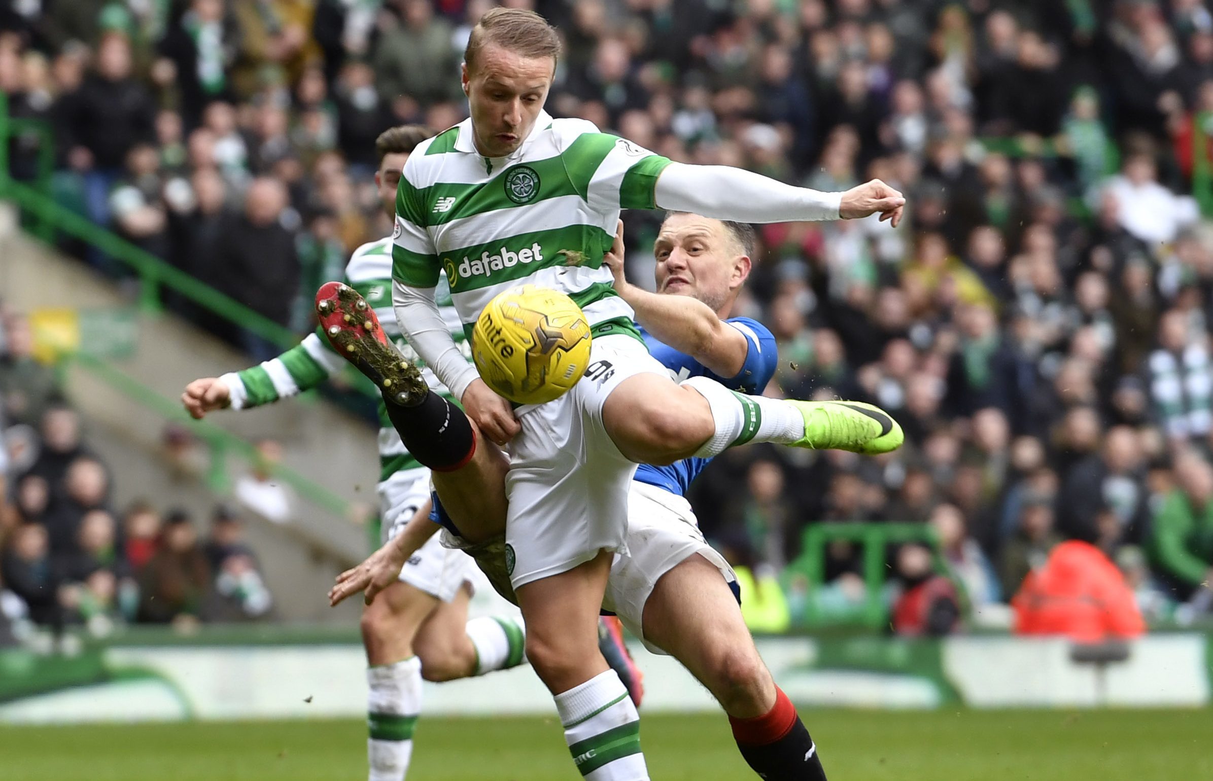 Celtic's players appeal for a penalty as Leigh Griffiths (left) is tackled by Rangers' Clint Hill in the last minute (SNS)