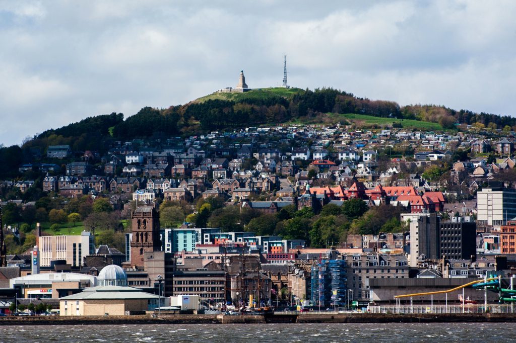 Skyline view of Dundee waterfront - view of the waterfront, and the former Olympia Swimming Pool, Discovery Point and The Law in Dundee, from Fife. (iStock)