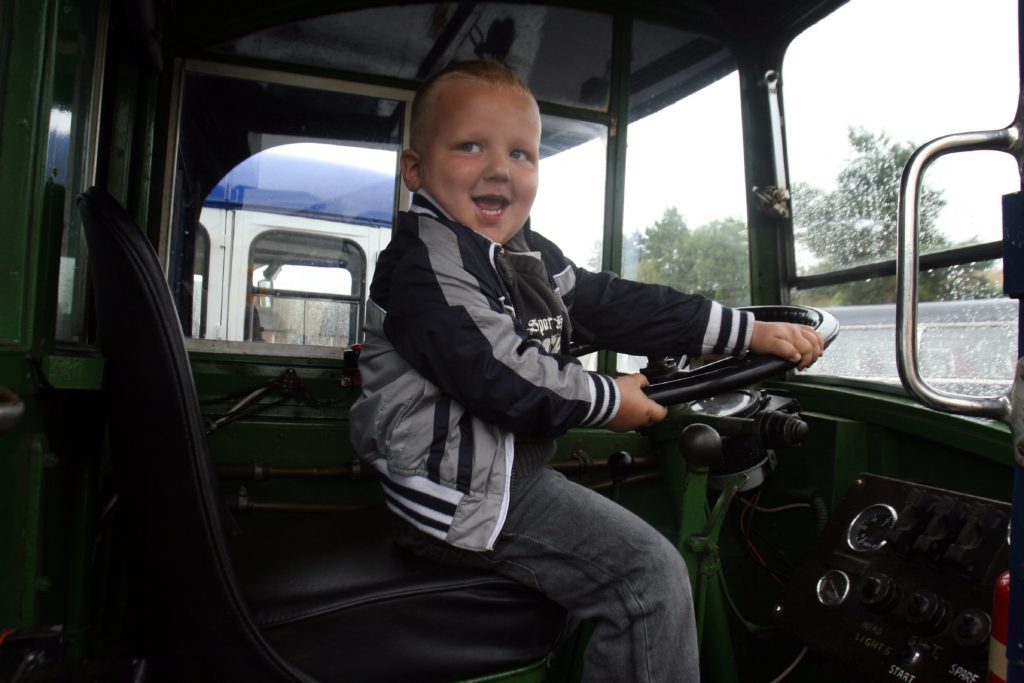 The Scottish Vintage Bus Museum. Three-year-old Toby Brown enjoys the day despite the weather.