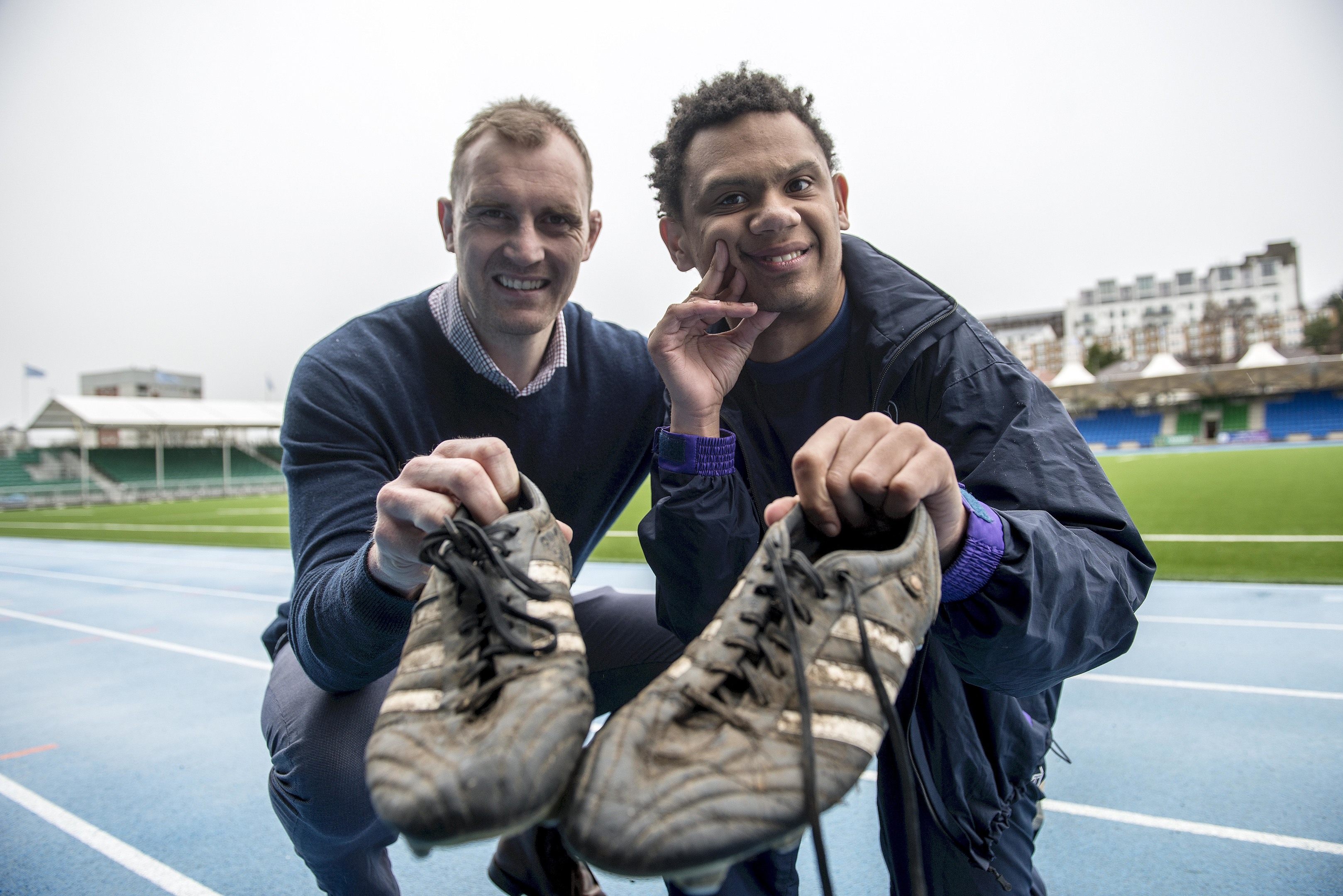 Former Scotland rugby captain Alastair Kellock and Alex Cuthbertson , to whom he donated his old training boots (Wattie Cheung)