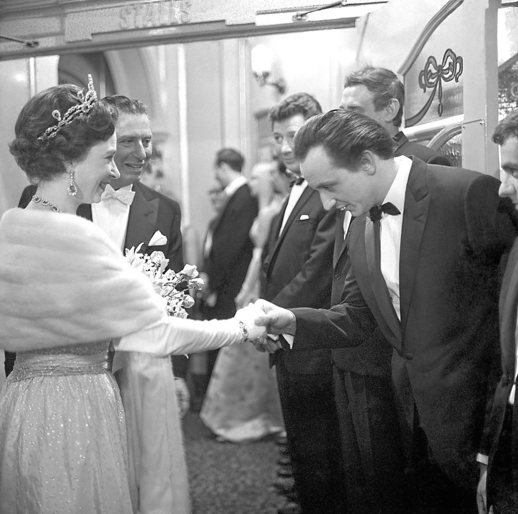 Ken meeting the Queen in 1965 (PA)