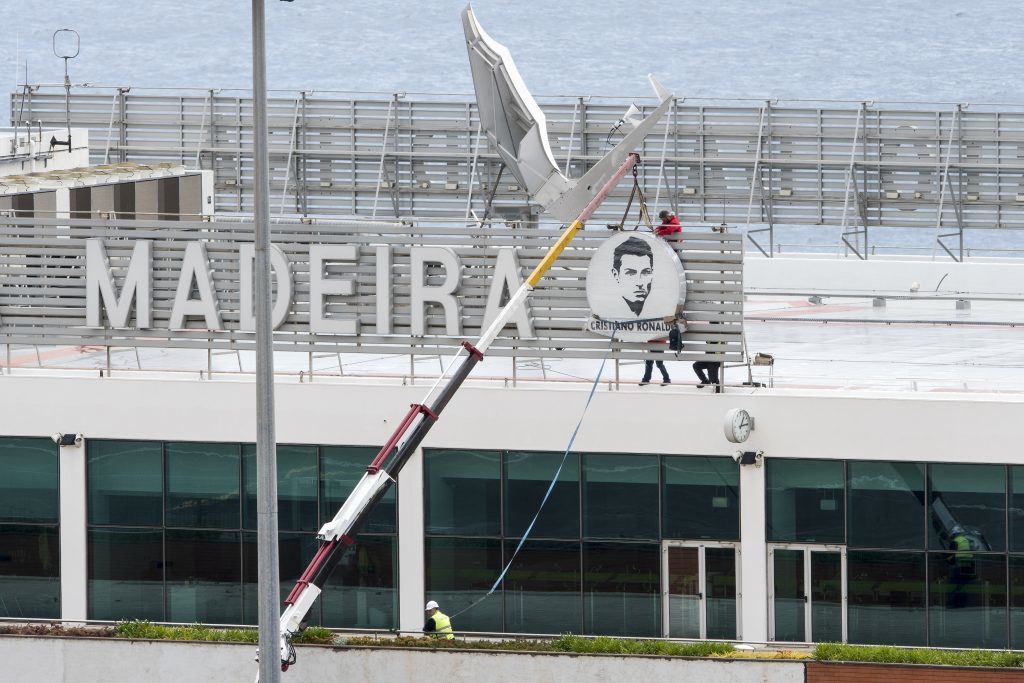FUNCHAL, MADEIRA, PORTUGAL - MARCH 24: Workers began the renaming works of the Madeira International Airport on March 24, 2017 in Funchal, Madeira, Portugal. Local government have decided to rename the island's main airport after the Madeira-born footballer Cristiano Ronaldo.  The official inauguration ceremony is due to take place on 29 March - the day after a friendly between the country's national team and Sweden in the island's capital, Funchal.  (Photo by Octavio Passos/Getty Images)