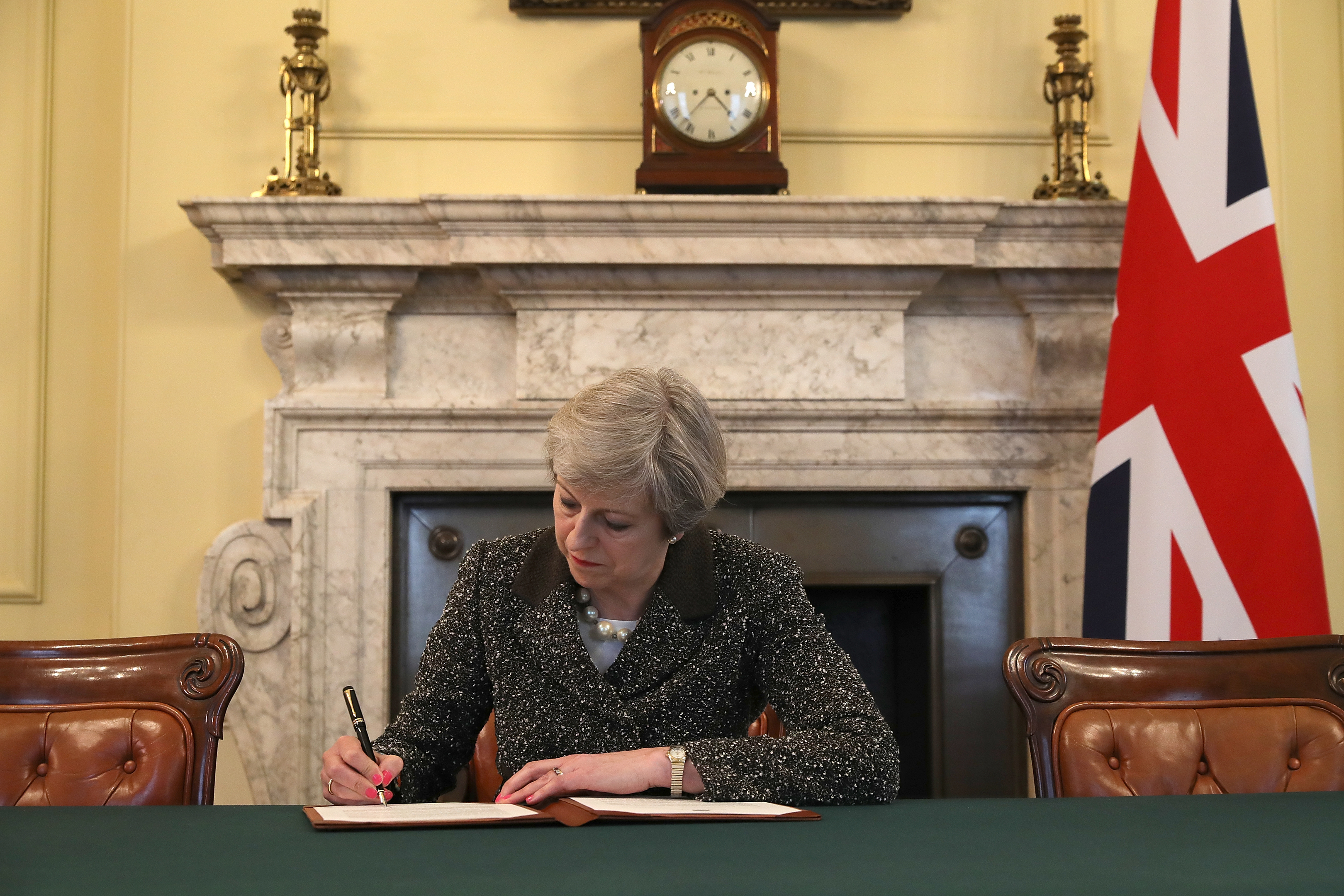 Theresa May signs the official letter to European Council President Donald Tusk (Christopher Furlong - WPA Pool/Getty Images)