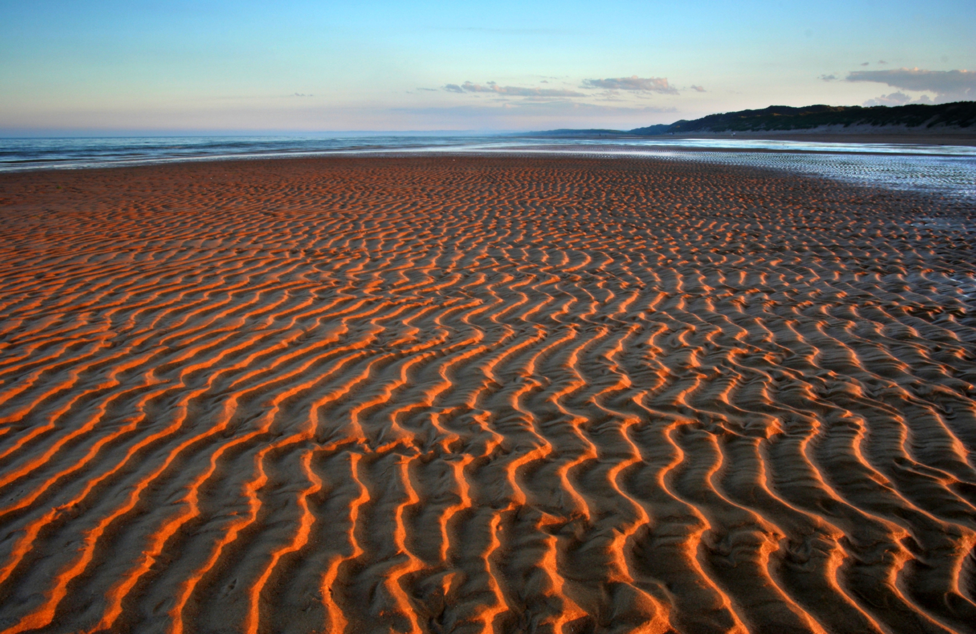 Hypnotic patterns in the sand intensified by the setting sun at Balmedie beach north of Aberdeen  (Alamy)