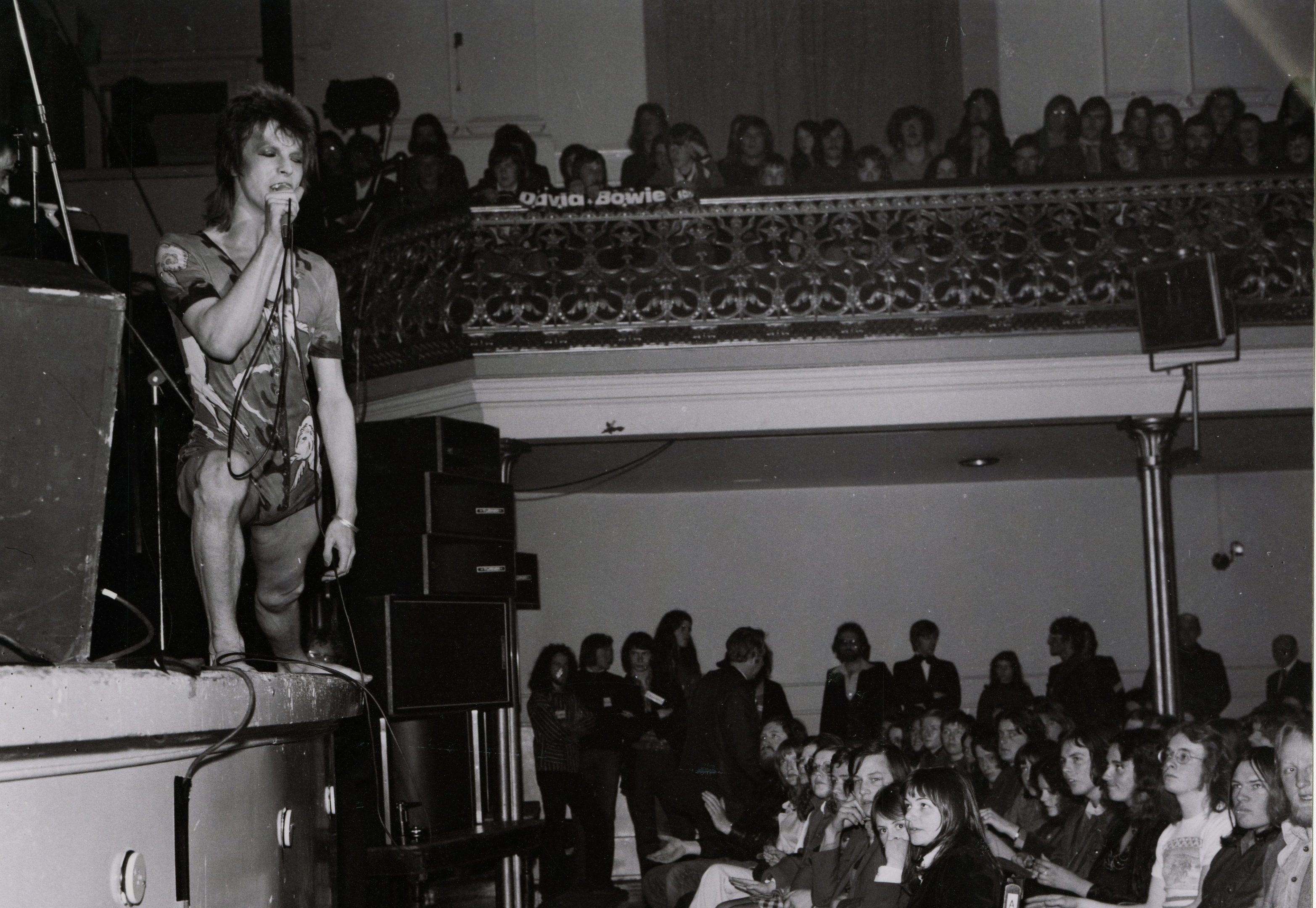 David Bowie in Ziggy Stardust guise tries to win over a rather sceptical Aberdeen audience at the Music Hall in 1973." (AJL)
