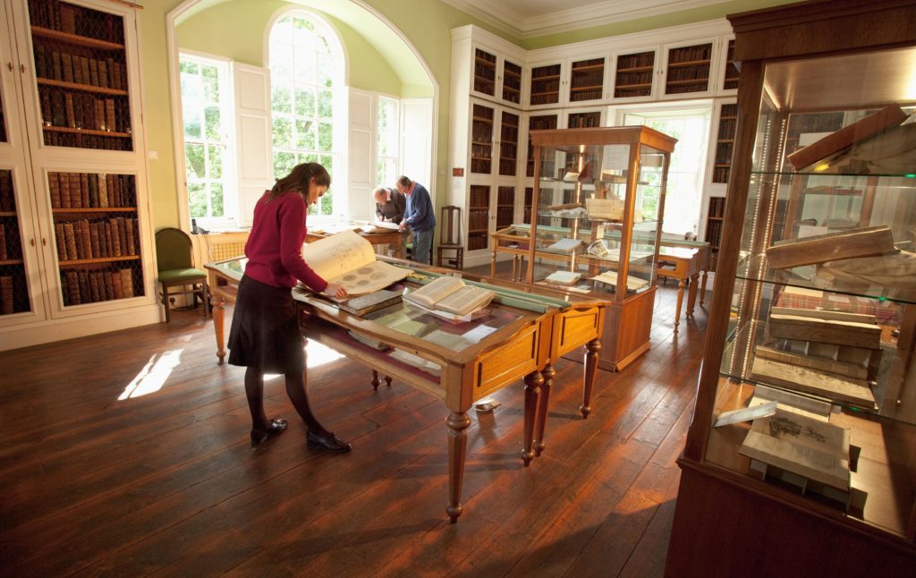 Visitors study the various books on display at the Innerpeffray Library - Scotland's first free Public Lending Library, by Crieff