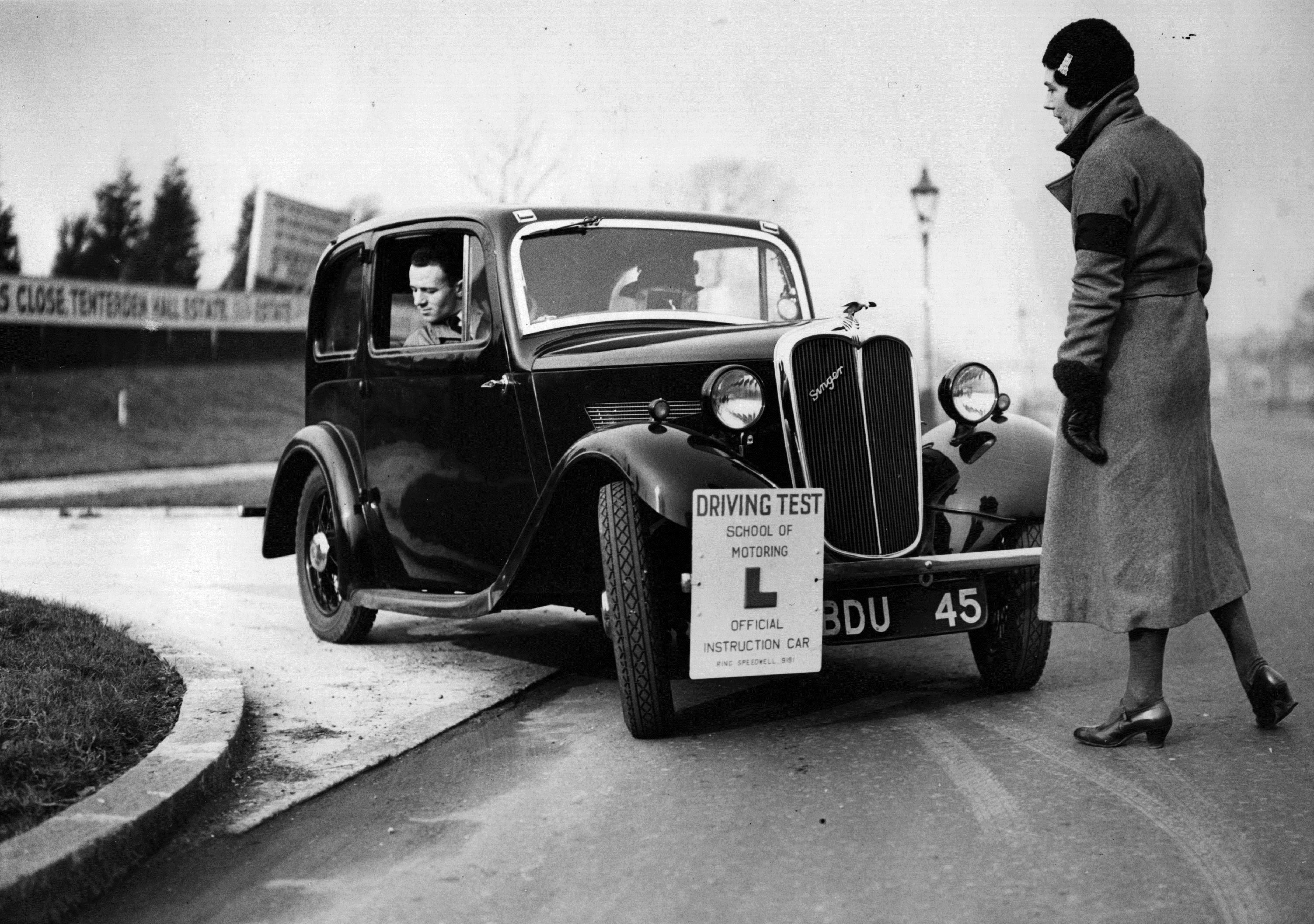 Driving instructor Miss Victoria Worsley instructs one of her pupils to reverse round a corner at her driving test school. (Fred Morley/Getty Images)