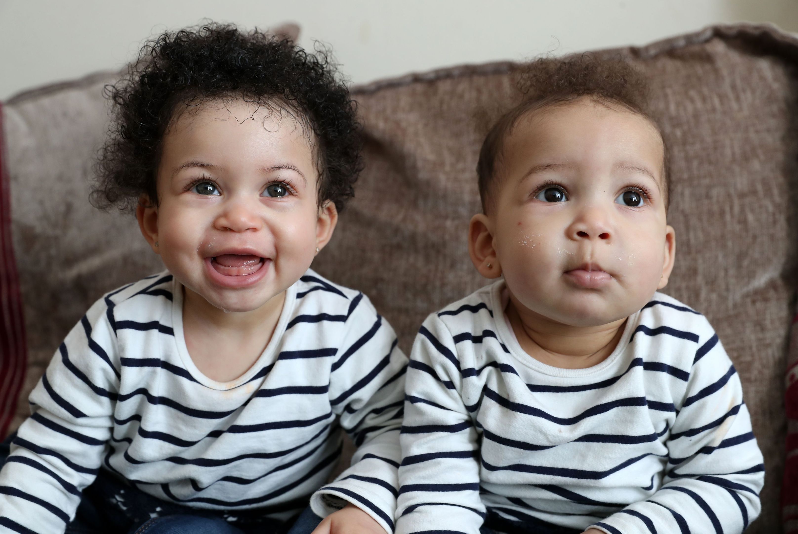 Nyobi (left) and Kenya, daughters of Tracy and Pete Akoun, who were born a month apart to two different lesbian surrogate mothers, at home in Portsmouth. (Andrew Matthews/PA Wire)