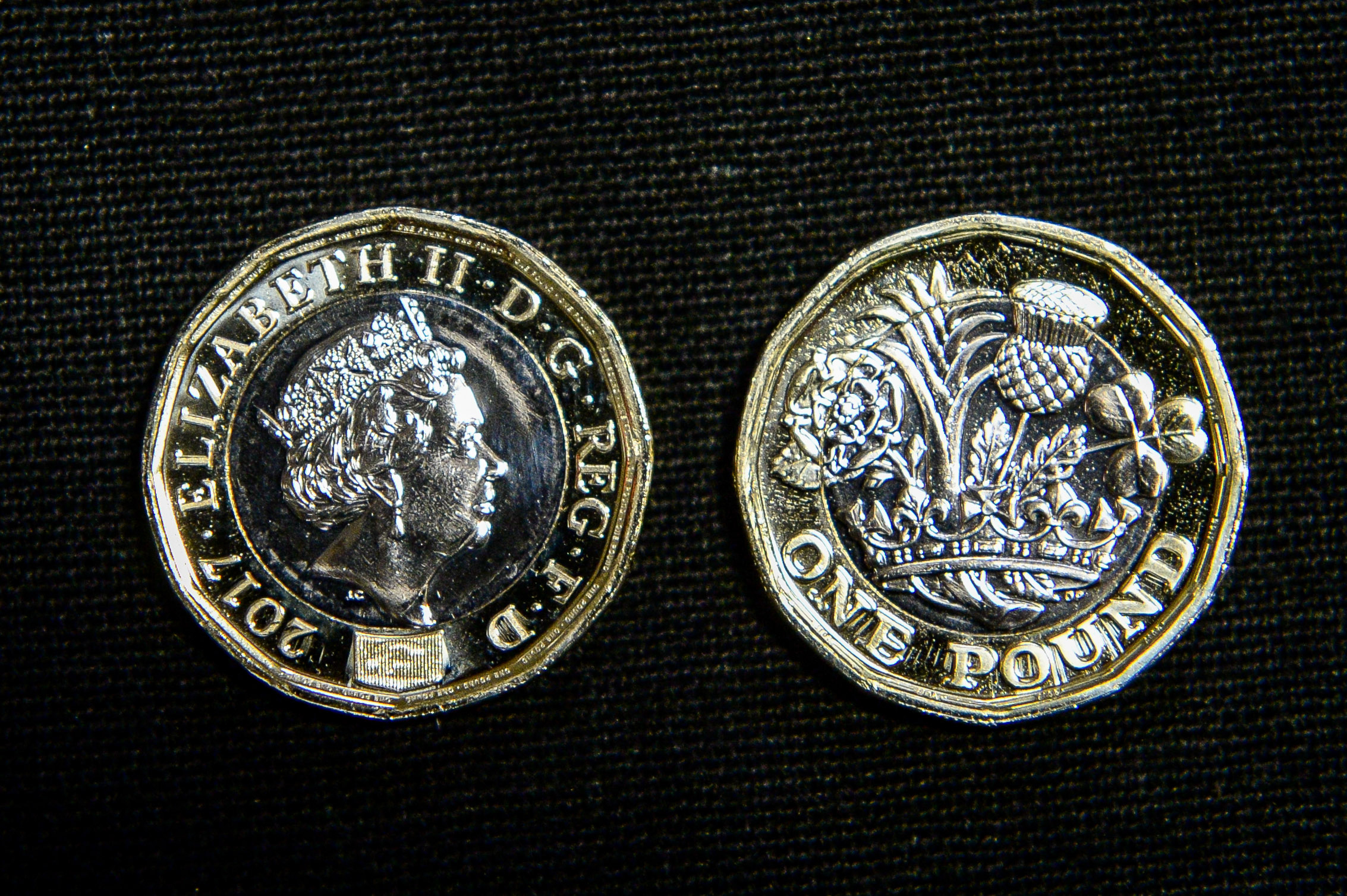Both faces of a 12-sided one pound coin (Ben Birchall/PA Wire)