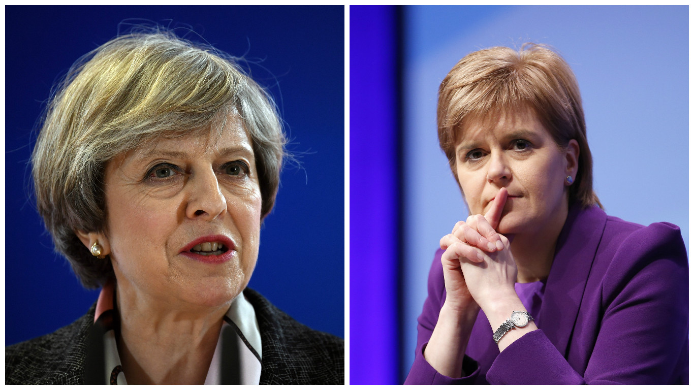 Theresa May (left) scored more favourably than First Minister Nicola Sturgeon (PA)