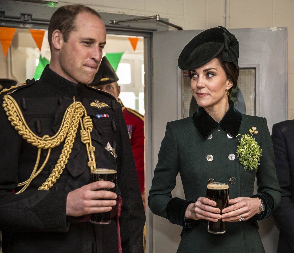 The Duke and Duchess of Cambridge stand with pints of Guinness in their hands as they meet with soldiers of the 1st Battalion Irish Guards in their canteen following their St Patrick's Day parade at Cavalry Barracks, Hounslow. PRESS ASSOCIATION Photo. Picture date: Friday March 17, 2017. See PA story ROYAL Cambridge. Photo credit should read: Yui Mok/PA Wire