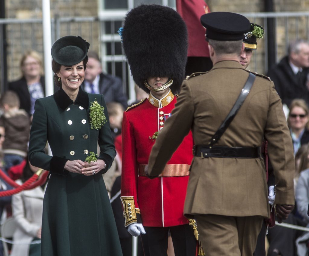 The Duchess of Cambridge hands out bunches of Shamrocks to soldiers of the 1st Battalion Irish Guards during their St Patrick's day Parade at Cavalry Barracks, Hounslow. PRESS ASSOCIATION Photo. Picture date: Friday March 17, 2017. See PA story ROYAL Cambridge. Photo credit should read: Yui Mok/PA Wire
