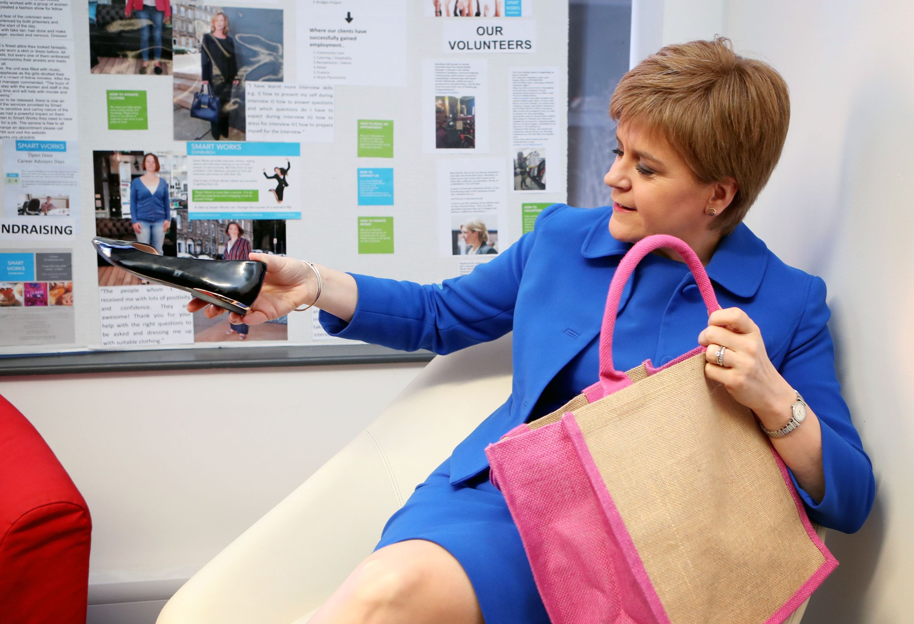 First Minister Nicola Sturgeon donates a pair of shoes to Smart Works in Edinburgh during an event to mark International Women’s Day. (Jane Barlow/PA Wire)