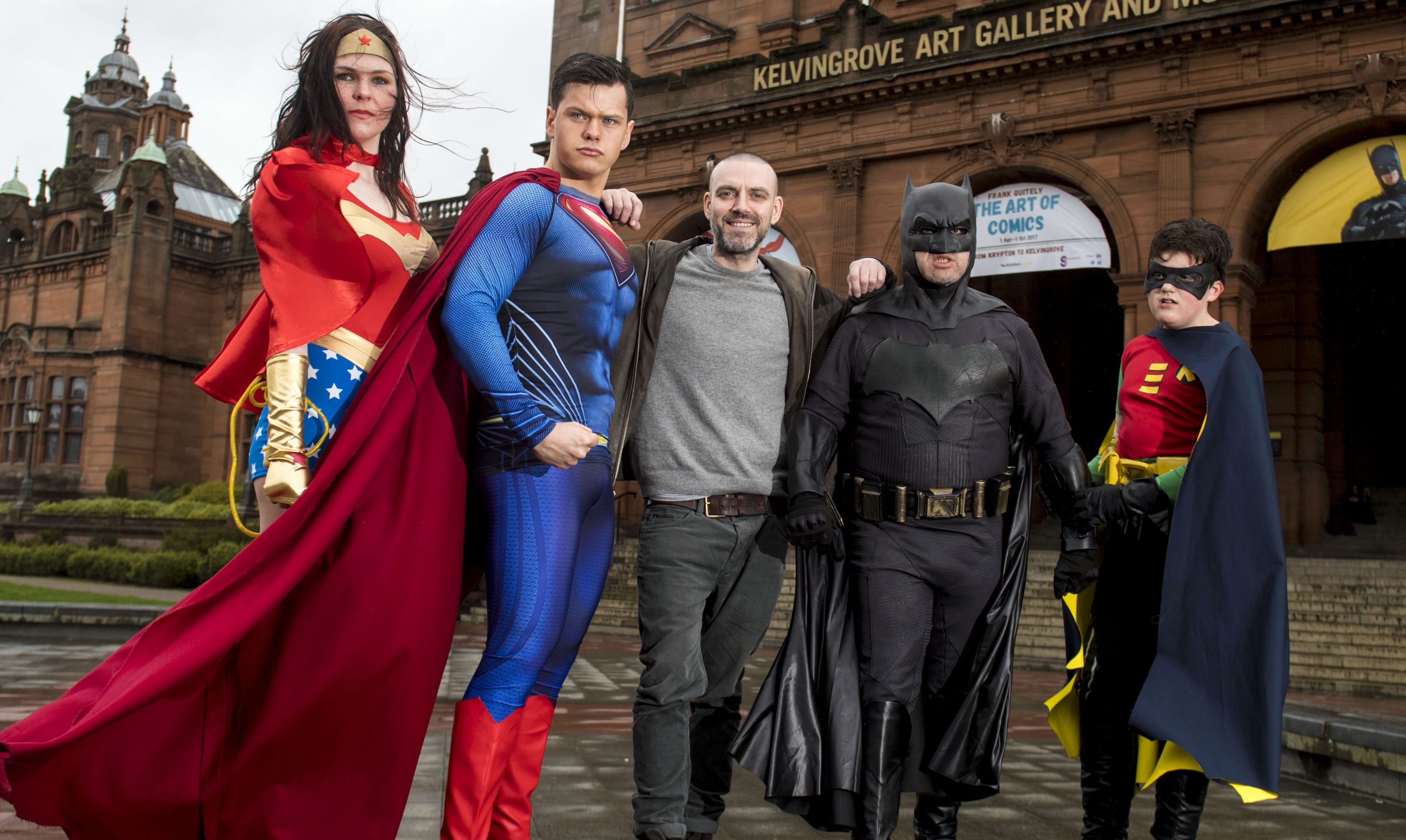 Glasgow born artist Frank Quitely is joined by Superman, Batman and Robin and Wonder Woman as they launch the exhibition (SNS Group / Alan Harvey)