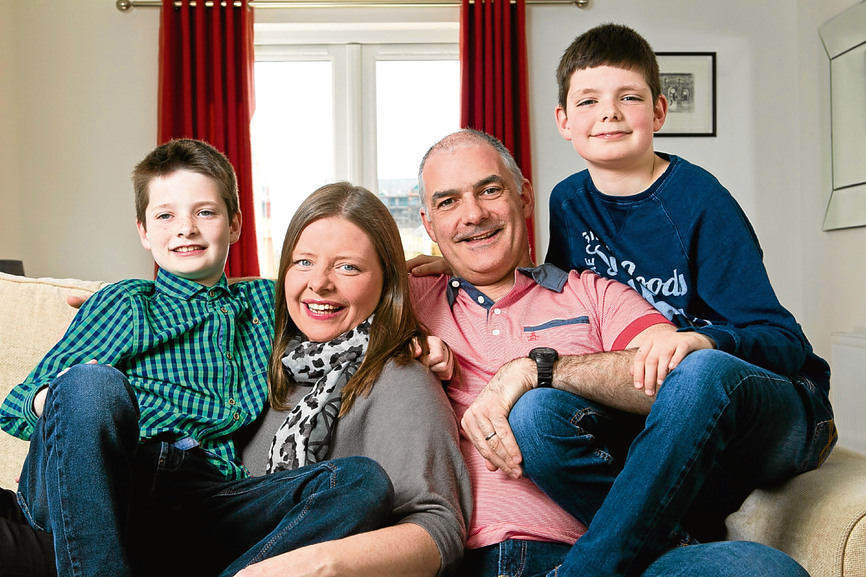 Susan Campbell, and her family, husband Stephen and sons Matthew (9), and Gregory (11). The family are taking part in a charity run called the Bubble Rush, raising money for The prince and princess of Wales Hospice, as Susan's father, John Downie, spent time their before he died. (Andrew Cawley)