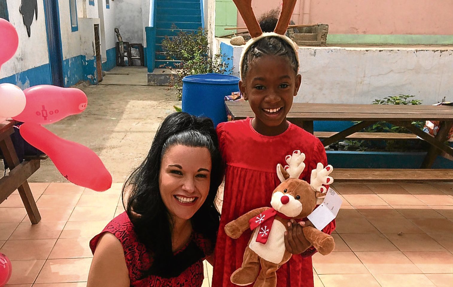 Elaine in Cape Verde with one of the kids who benefited from her Christmas campaign.