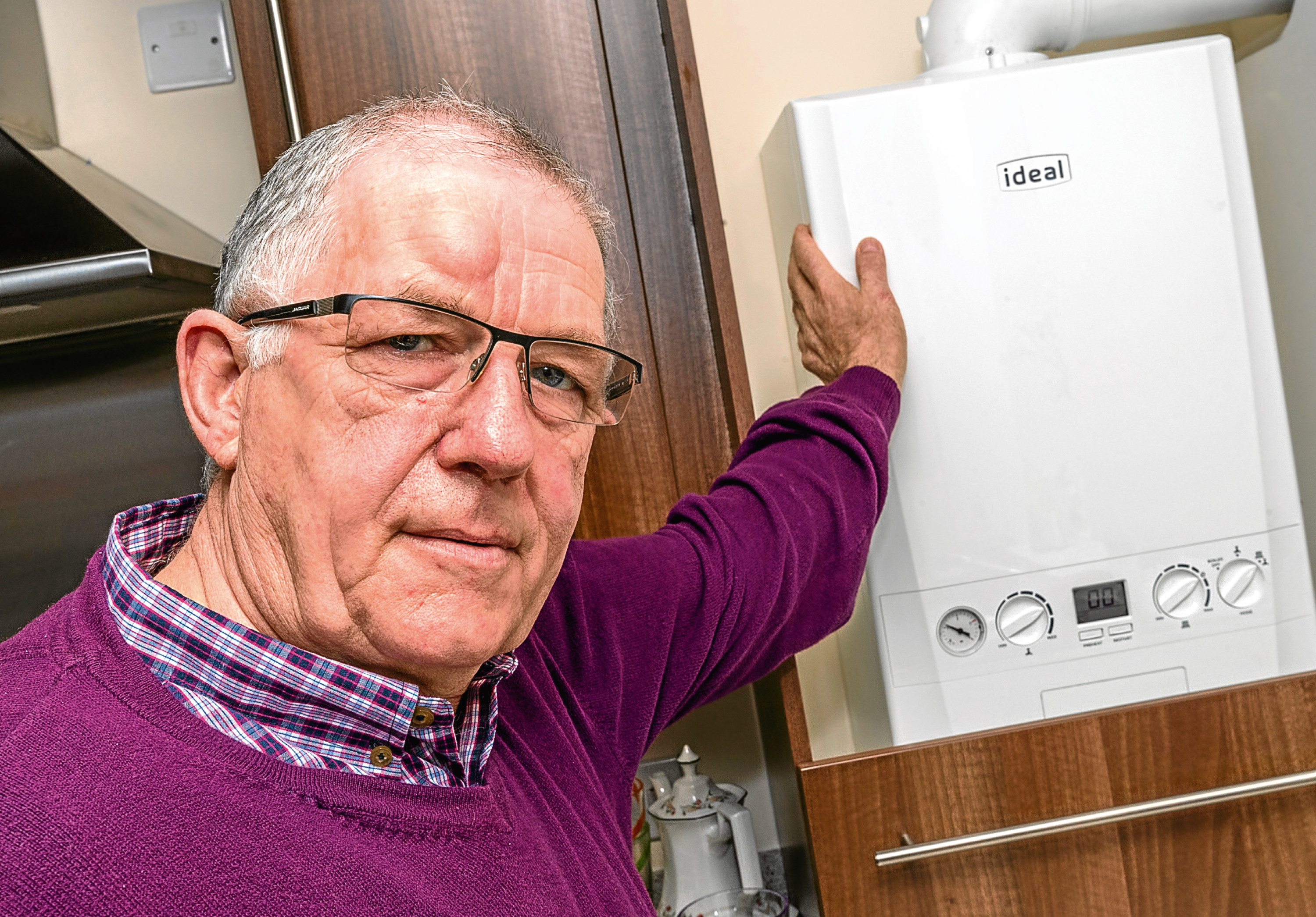 Graham Mackie of 7 Doocot Court, Elgin, Moray with his new boiler.