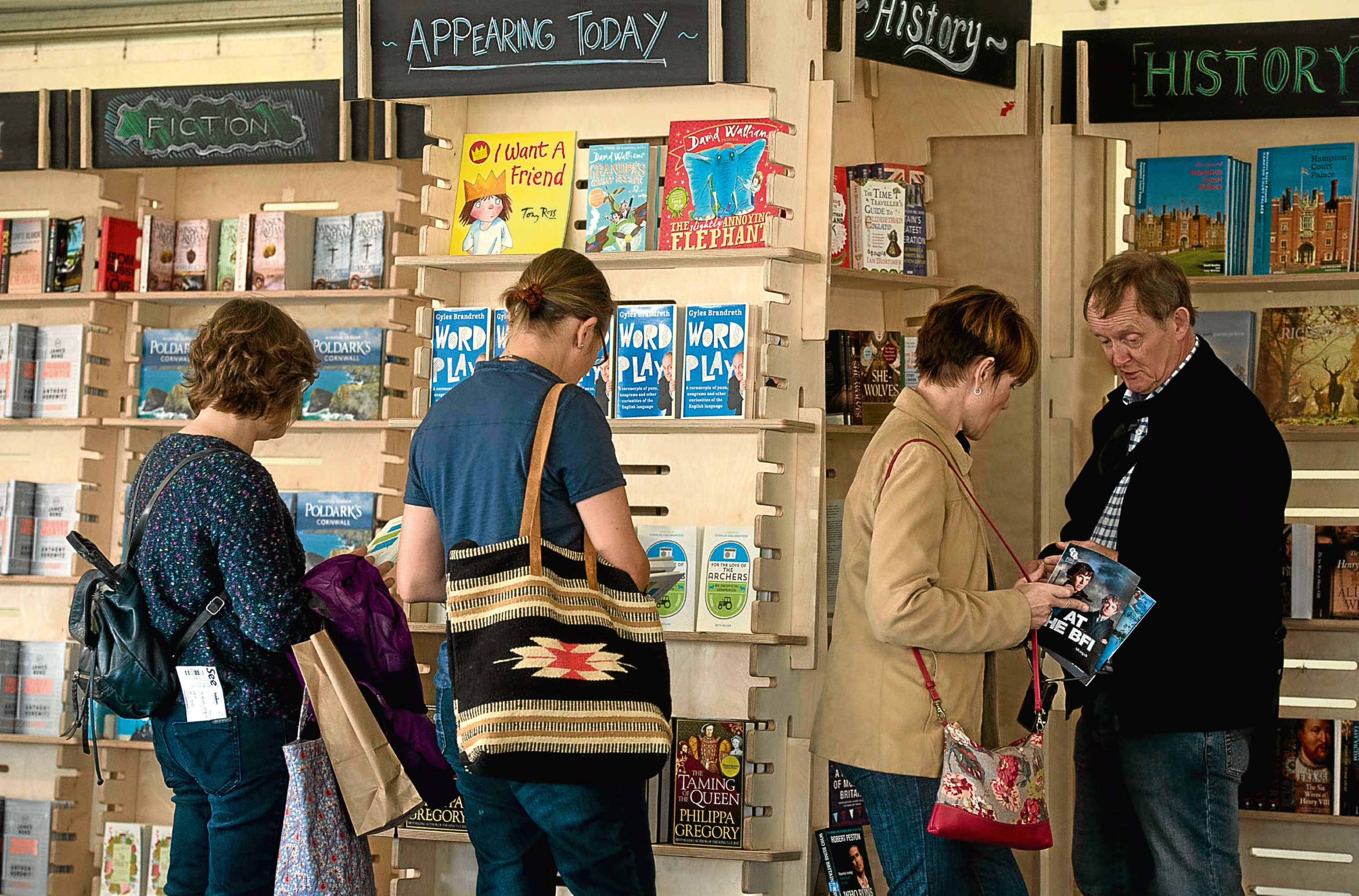 People browse a bookshop (iStock)