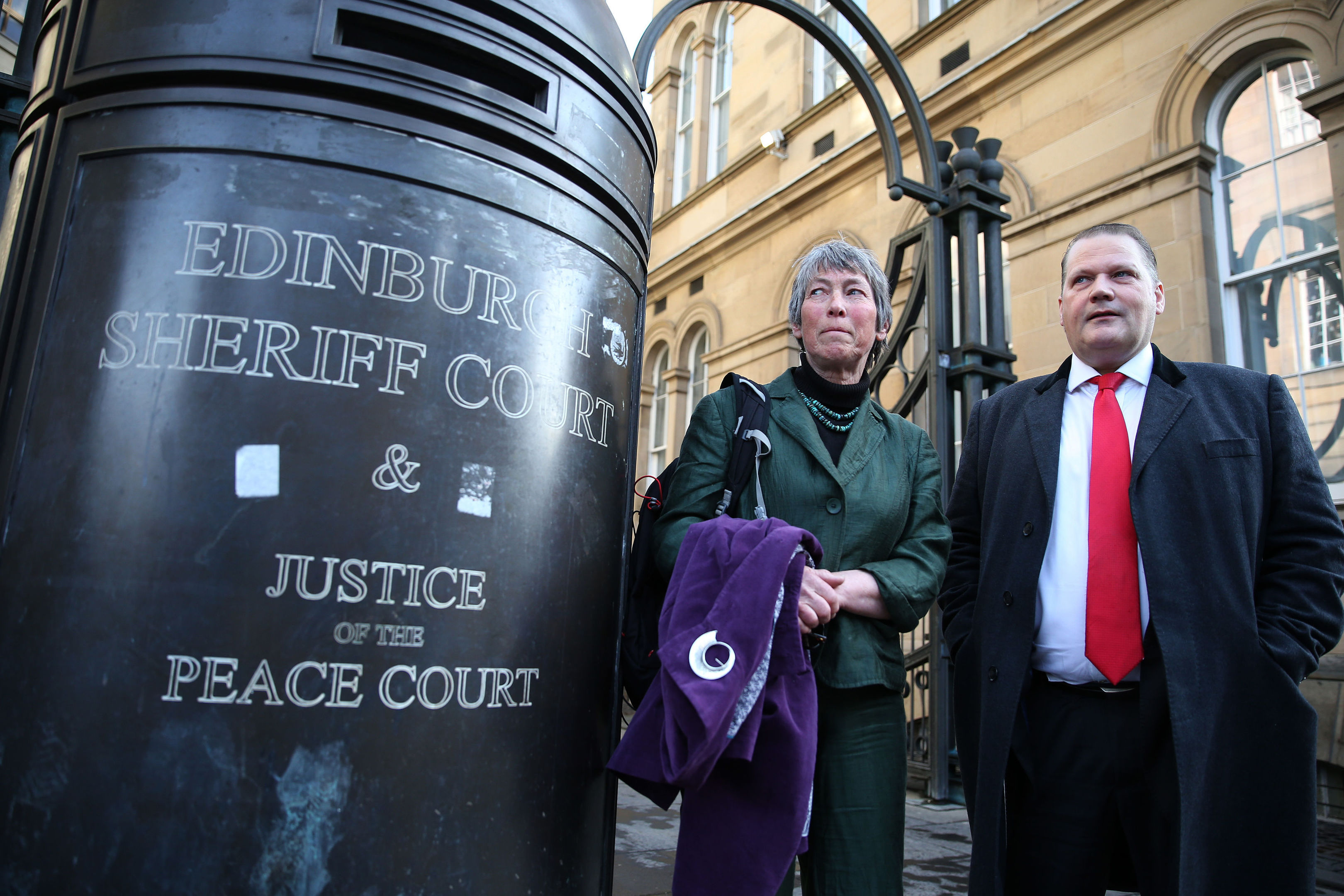Carol Rohan Beyts, with her lawyer lawyer Mike Dailly outside Edinburgh Sheriff Court, who has been permitted to pursue damages against Donald Trump's Aberdeenshire golf course over allegations that staff filmed her urinating. (Andrew Milligan/PA Wire)