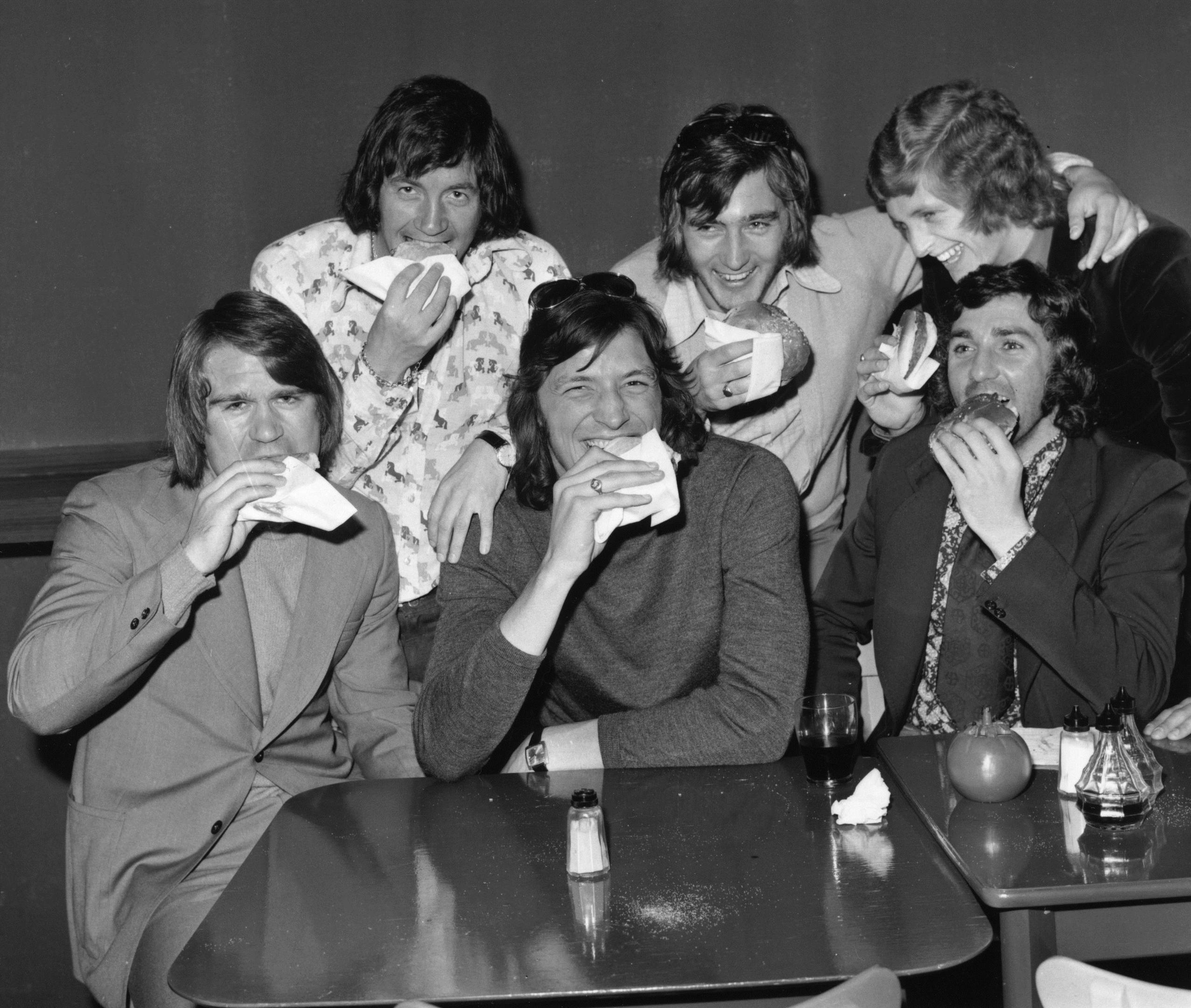 Chelsea players Dave Webb, John Boyle, Micky Droy, Alan Hudson, Chris Garland and Paddy Mulligan get stuck in to some hamburgers at a time when players weren’t told to care as much about their diet (Getty Images)