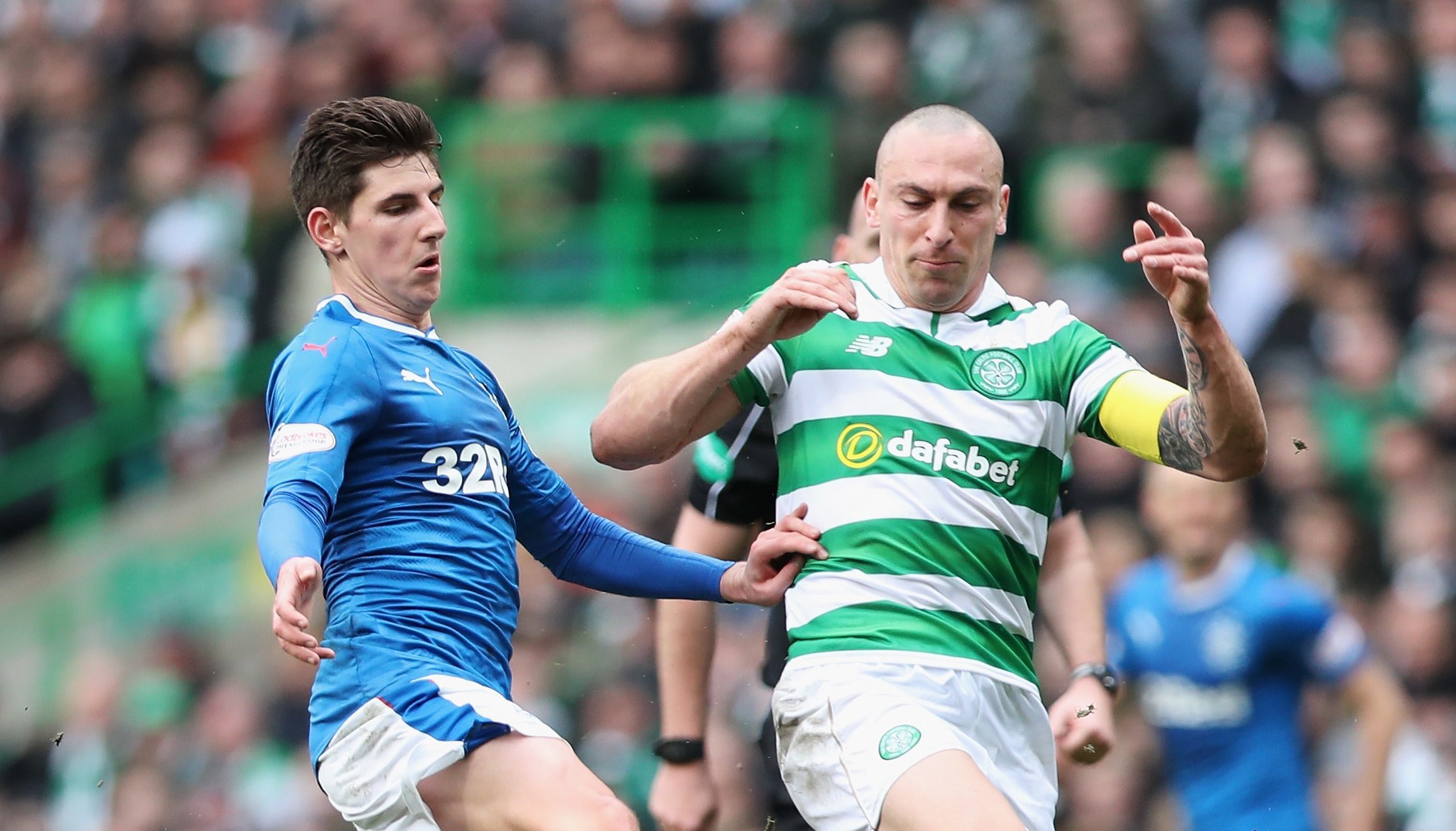 Emerson Hyndman of Rangers (L) and Scott Brown of Celtic (R) battle for possession (Ian MacNicol/Getty Images)