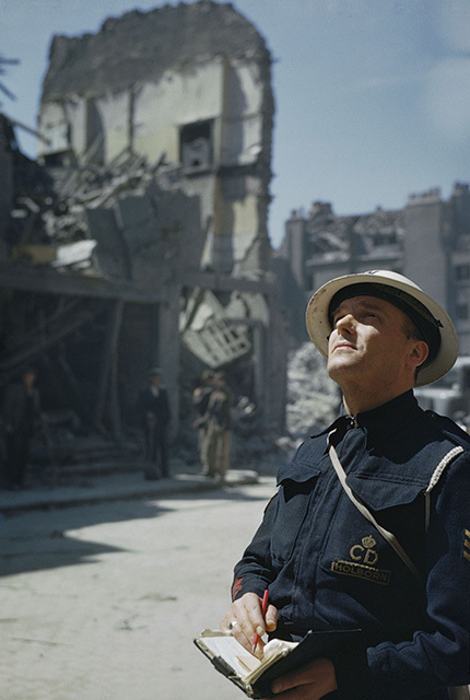 An Air Raid Precautions (ARP) warden inspecting damaged buildings in Holborn, London (Ted Dearberg/IWM/PA Wire)