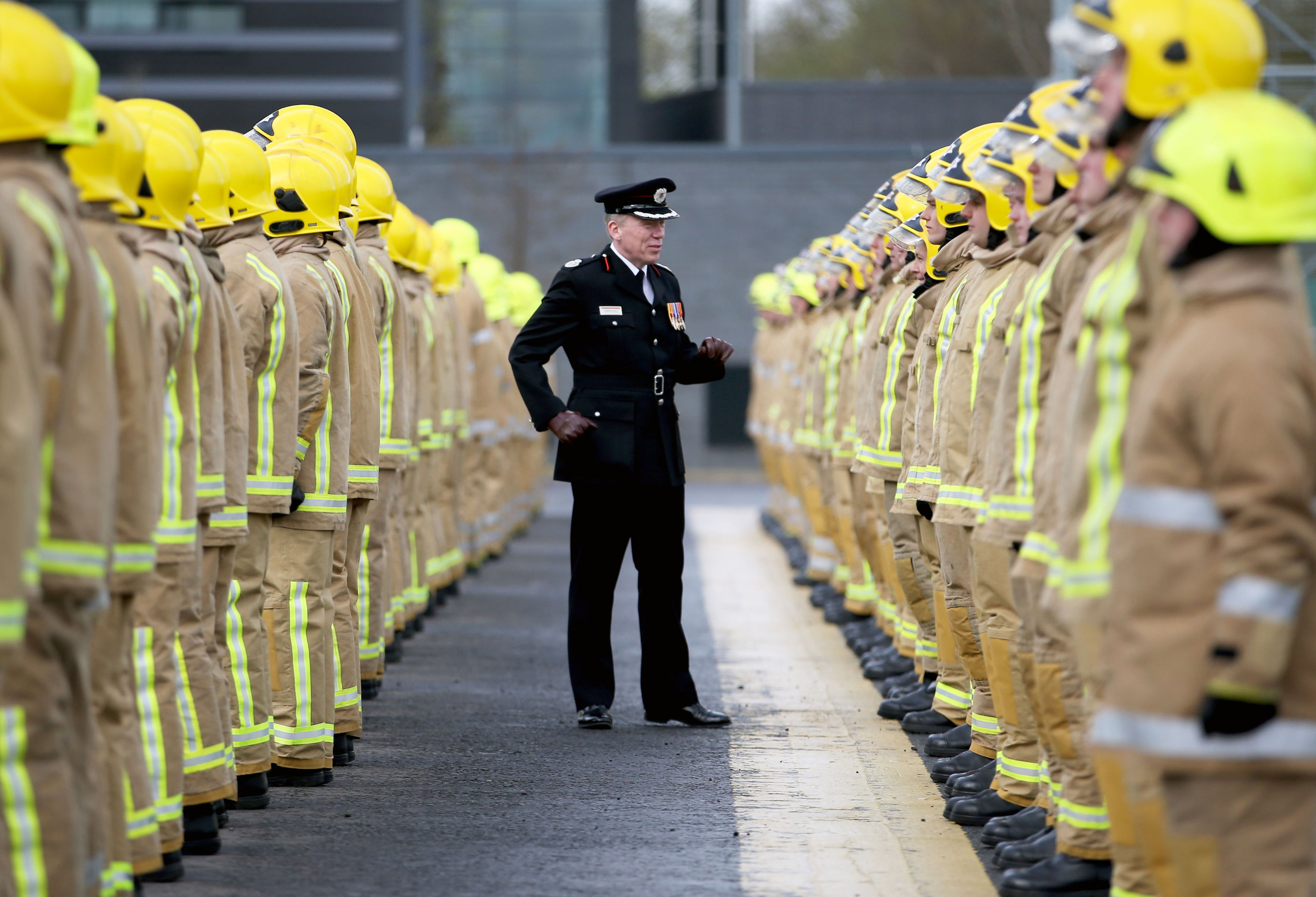 Assistant Chief Officer Lewis Ramsay inspects some of the 101 new full-time firefighters who have graduated in a special ceremony at the Scottish Fire and Rescue Service National Training Centre in Cambuslang, Glasgow. (Jane Barlow/PA Wire)